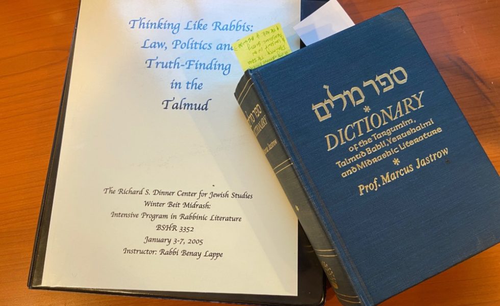 A Jastrow dictionary sits on top of a source packet, titled "Thinking Like the Rabbis," taught by Rabbi Benay Lappe.